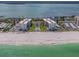 Aerial view of beachfront condos, pool, and the adjacent beach at 1430 Gulf Blvd # 707, Clearwater Beach, FL 33767