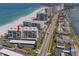 Aerial view of coastal condo building near a beautiful beach and scenic coastline at 1430 Gulf Blvd # 707, Clearwater Beach, FL 33767