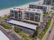 Beachfront condo complex with ocean views and ample parking. Red arrow points to available unit at 1430 Gulf Blvd # 707, Clearwater Beach, FL 33767