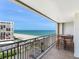 Balcony features a table with seating and a wonderful ocean view at 1430 Gulf Blvd # 707, Clearwater Beach, FL 33767