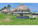 Enjoy relaxing beachside under thatched umbrellas with dining and seating areas on the manicured green lawn at 1430 Gulf Blvd # 707, Clearwater Beach, FL 33767