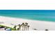 The breathtaking view from the balcony extends over the white sand beach and turquoise water at 1430 Gulf Blvd # 707, Clearwater Beach, FL 33767