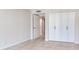 A simple bedroom with tile floors, a closet, and an open door to another room at 1430 Gulf Blvd # 707, Clearwater Beach, FL 33767