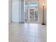 Bedroom with white curtains leading to a balcony with a view of the city at 1430 Gulf Blvd # 707, Clearwater Beach, FL 33767