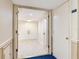 Hallway entrance features a doorway and light-colored walls, creating a bright and airy space at 1430 Gulf Blvd # 707, Clearwater Beach, FL 33767
