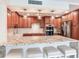 This kitchen features a large island with seating, stainless steel appliances, and custom cabinetry at 1430 Gulf Blvd # 707, Clearwater Beach, FL 33767