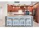 This kitchen features a breakfast bar, pendant lights and stainless steel appliances at 1430 Gulf Blvd # 707, Clearwater Beach, FL 33767