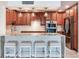 This kitchen features a large island with seating, stainless steel appliances, and custom cabinetry at 1430 Gulf Blvd # 707, Clearwater Beach, FL 33767