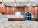 A granite countertop overlooks stainless steel appliances and custom wood cabinetry at 1430 Gulf Blvd # 707, Clearwater Beach, FL 33767
