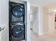 Stacked washer and dryer in closet at 1430 Gulf Blvd # 707, Clearwater Beach, FL 33767