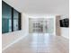 Spacious living room with tile flooring, modern design, and balcony access offering city views at 1430 Gulf Blvd # 707, Clearwater Beach, FL 33767