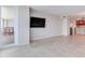 Open-concept living room flows into the kitchen with tile flooring and a balcony at 1430 Gulf Blvd # 707, Clearwater Beach, FL 33767