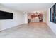 Spacious living room and kitchen area with tile flooring and natural light at 1430 Gulf Blvd # 707, Clearwater Beach, FL 33767
