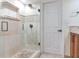 This shower features a glass surround, rainfall shower head and custom tile at 1430 Gulf Blvd # 707, Clearwater Beach, FL 33767