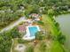 Aerial view of the community pool, clubhouse and lake at 14732 Morning Dr, Lutz, FL 33559