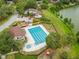 Aerial view of the community pool, clubhouse and lake at 14732 Morning Dr, Lutz, FL 33559