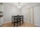 Cozy dining area with modern light fixture and sliding door leading to the outside at 14732 Morning Dr, Lutz, FL 33559