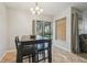 Cozy dining area with tile floors and sliding glass doors providing natural light at 14732 Morning Dr, Lutz, FL 33559