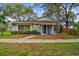 Inviting single-story home with well-maintained landscaping and serene curb appeal at 14732 Morning Dr, Lutz, FL 33559