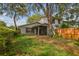 Charming two-story home with mature trees and a cozy screened-in porch at 14732 Morning Dr, Lutz, FL 33559