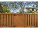 Wooden fence with visible house number, ensuring privacy and security at 14732 Morning Dr, Lutz, FL 33559