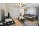 Spacious living room with tile flooring, ceiling fan, and an open layout at 14732 Morning Dr, Lutz, FL 33559
