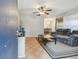 Open-concept living room featuring tile floors, ceiling fan and a comfortable seating area at 14732 Morning Dr, Lutz, FL 33559