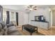Comfortable living room showcasing tile floors, ceiling fan, and a functional layout at 14732 Morning Dr, Lutz, FL 33559