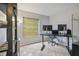 Bright office space with tile floors, shelving, and dual monitors for optimal productivity at 14732 Morning Dr, Lutz, FL 33559