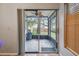 Screened patio with ceiling fan offering a relaxing outdoor living space at 14732 Morning Dr, Lutz, FL 33559