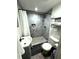 Modern bathroom with a stylish shower and gray tile at 1515 E Hanna Ave, Tampa, FL 33610
