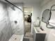 This full bathroom boasts a tiled shower with a rainfall showerhead, and modern vanity at 1515 E Hanna Ave, Tampa, FL 33610