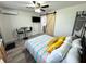 Bright bedroom with a barn door, a bed, sitting area, and stylish decor at 1515 E Hanna Ave, Tampa, FL 33610