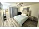 Inviting bedroom with wood floors, ceiling fan, and a tranquil atmosphere at 1515 E Hanna Ave, Tampa, FL 33610
