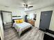 Well lit open floorplan with kitchen, bed, and sitting area at 1515 E Hanna Ave, Tampa, FL 33610