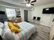 Studio apartment with a bed, kitchenette, and TV at 1515 E Hanna Ave, Tampa, FL 33610