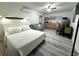 Bright studio with a bed, seating area, and kitchenette, all in an open layout at 1515 E Hanna Ave, Tampa, FL 33610