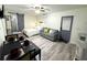 This studio features a bed, seating area, kitchenette, and modern finishes for comfortable living at 1515 E Hanna Ave, Tampa, FL 33610