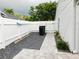 Fenced backyard with stone walkway, crushed rock and room for outdoor activities at 15916 Marshfield Dr, Tampa, FL 33624