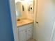 Compact bathroom featuring a vanity with drawers and a mirrored medicine cabinet at 15916 Marshfield Dr, Tampa, FL 33624