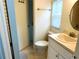 Cozy bathroom featuring a classic sink, toilet, and a window for natural light at 15916 Marshfield Dr, Tampa, FL 33624