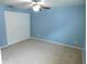 Spacious bedroom featuring a ceiling fan, neutral carpet, and a large closet at 15916 Marshfield Dr, Tampa, FL 33624