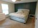 Spacious bedroom with a large window and a comfortable king-size bed at 15916 Marshfield Dr, Tampa, FL 33624