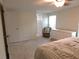 Bright bedroom featuring a chair and dresser in a well lit neutral color scheme at 15916 Marshfield Dr, Tampa, FL 33624
