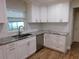 Bright kitchen features white cabinets, granite countertops, stainless steel appliances at 15916 Marshfield Dr, Tampa, FL 33624