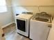 Bright laundry room featuring a Samsung washing machine and dryer set at 15916 Marshfield Dr, Tampa, FL 33624