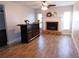 Comfortable living room with a traditional fireplace and stylish dark wood bar at 15916 Marshfield Dr, Tampa, FL 33624