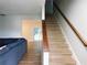 Inviting living room featuring a staircase and a view of the outdoor pool area at 15916 Marshfield Dr, Tampa, FL 33624