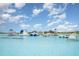 Aqua park with obstacle course on a beautiful day with blue skies and fluffy white clouds in a Gathering friendly community at 16624 Maude Dr, Wimauma, FL 33598