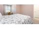 Well-lit bedroom featuring plush carpets, neutral walls, and comfortable window seating at 16624 Maude Dr, Wimauma, FL 33598
